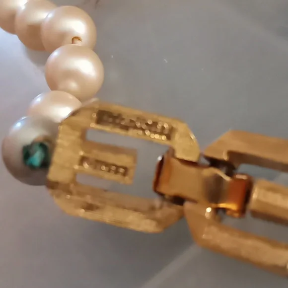 Givenchy pearl necklace with gold tone clasp.In Excellent Mint Unused Condition